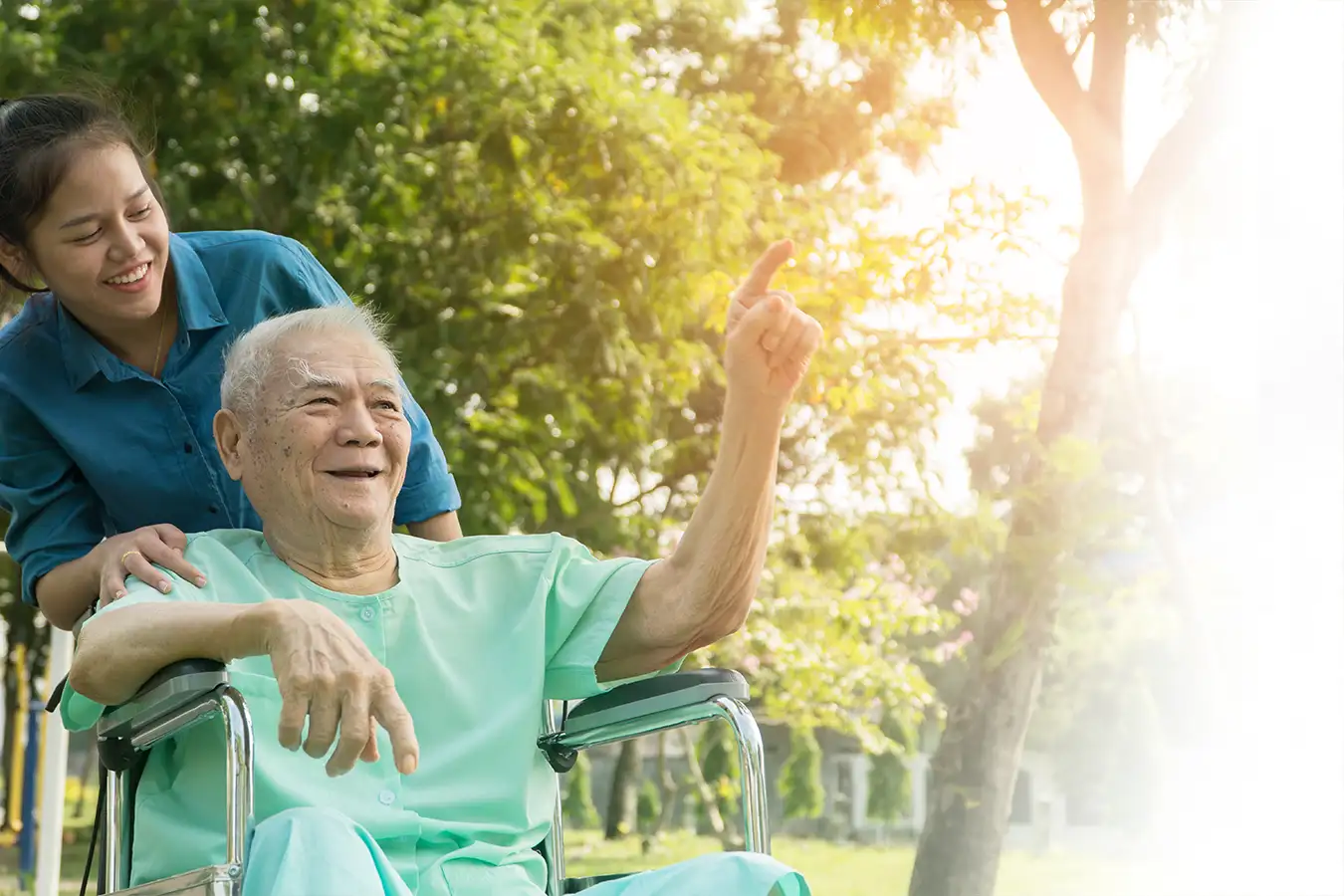 A caregiver with a smiling patient outdoors, C-E-U.com dementia training