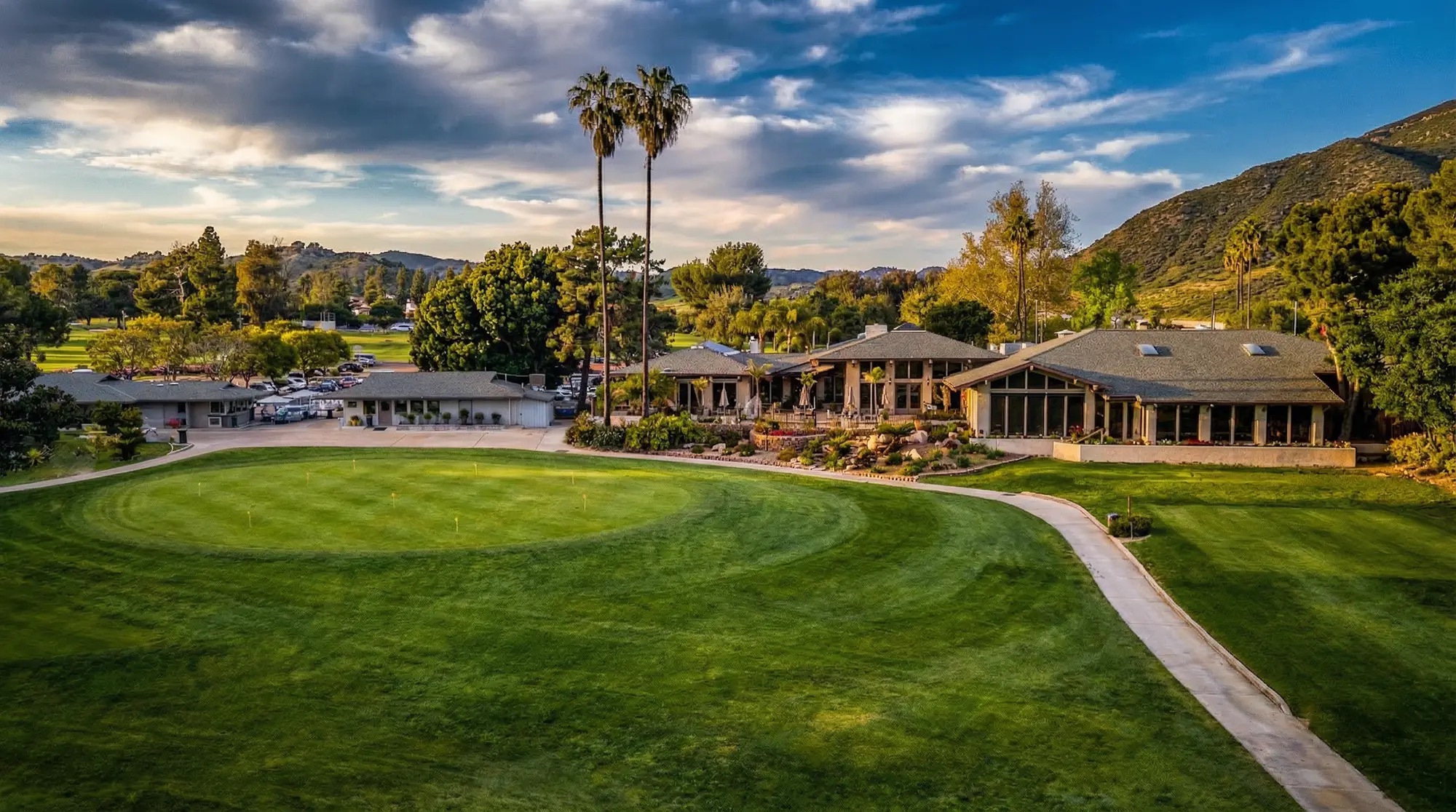 The Pala Mesa Resort golf course and clubhouse at sunset