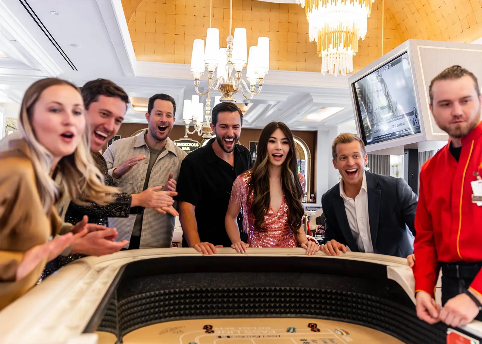 Guests celebrating at a table game on the Chamonix casino floor