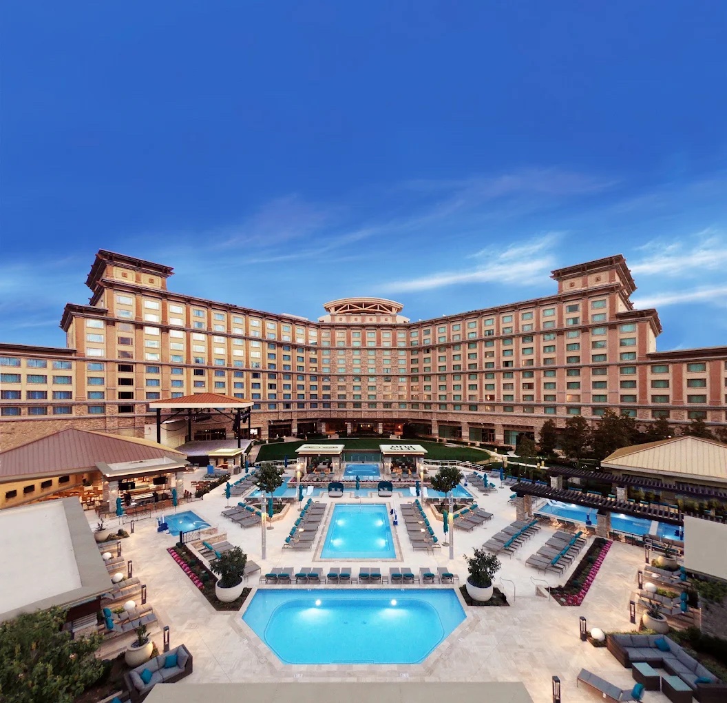 Aerial view of the Pala Casino Spa Golf Resort hotel and pool complex at dusk